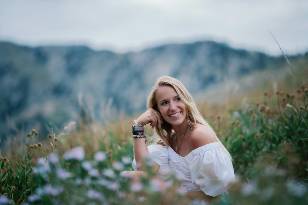 a woman in a field of flowers