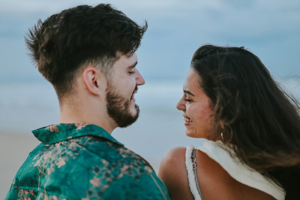 Couple looking at each other at the beach